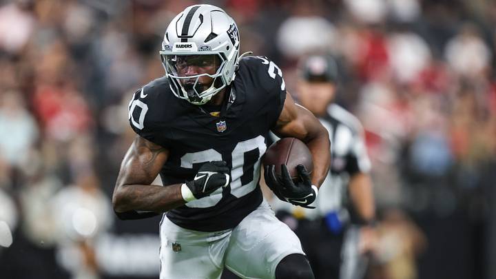 Aug 27, 2026; Paradise, Nevada, USA; Las Vegas Raiders running back Mike Washington Jr. (30) carries the ball against the San Francisco 49ers during the first half at Allegiant Stadium. Mandatory Credit: Christopher Trim-Imagn Images