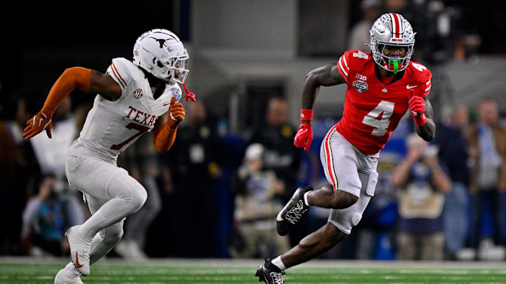 Ohio State Buckeyes wide receiver Jeremiah Smith (4) and Texas Longhorns defensive back Jahdae Barron (7) in action during the game Ohio State Buckeyes wide receiver Jeremiah Smith (4) and Texas Longhorns defensive back Jahdae Barron (7) in action during the game
