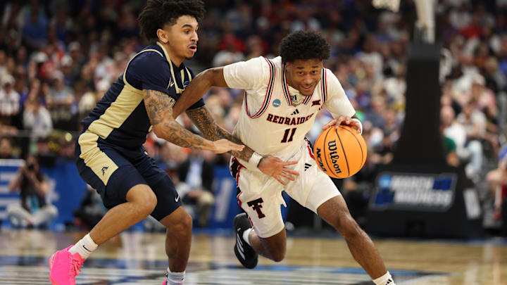 Mar 20, 2026; Tampa, FL, USA; Texas Tech Red Raiders guard Jaylen Petty (11) drives against Akron Zips guard Sharron Young (3) in the second half during a first round game of the men's 2026 NCAA Tournament at Benchmark International Arena. Mandatory Credit: Nathan Ray Seebeck-Imagn Images
