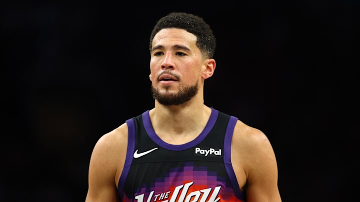 Mar 28, 2026; Phoenix, Arizona, USA; Phoenix Suns guard Devin Booker (1) against the Utah Jazz in the second half at Mortgage Matchup Center. Mandatory Credit: Mark J. Rebilas-Imagn Images