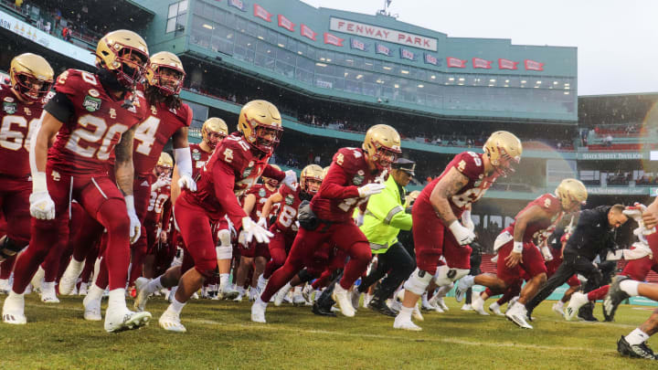 The Boston College football team took the field before the second annual Wasabi Fenway Bowl vs. SMU at Fenway Park on Thursday, Dec. 28, 2023. The Boston College football team took the field before the second annual Wasabi Fenway Bowl vs. SMU at Fenway Park on Thursday, Dec. 28, 2023.