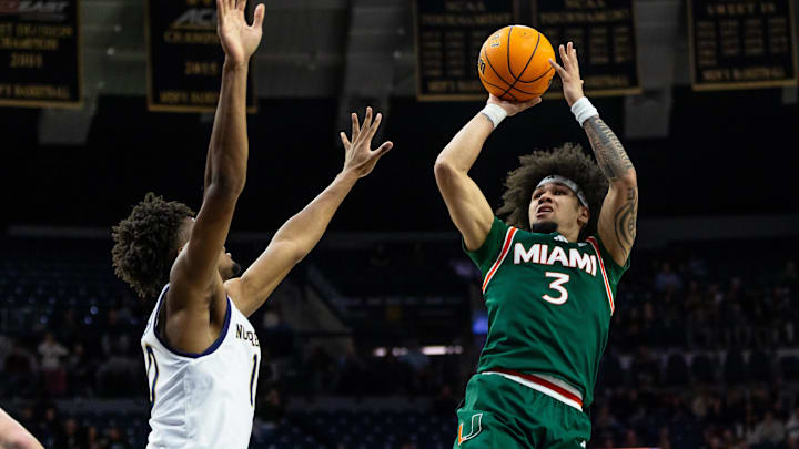 Jan 13, 2026; South Bend, Indiana, USA; Miami (FL) Hurricanes guard Tre Donaldson (3) shoots as Notre Dame Fighting Irish forward Jalen Haralson (10) defends during the second half at Purcell Pavilion at the Joyce Center. Mandatory Credit: Michael Caterina-Imagn Images Jan 13, 2026; South Bend, Indiana, USA; Miami (FL) Hurricanes guard Tre Donaldson (3) shoots as Notre Dame Fighting Irish forward Jalen Haralson (10) defends during the second half at Purcell Pavilion at the Joyce Center. Mandatory Credit: Michael Caterina-Imagn Images