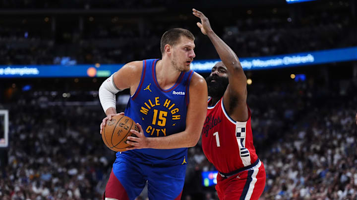 May 3, 2025; Denver, Colorado, USA; LA Clippers guard James Harden (1) defends on Denver Nuggets center Nikola Jokic (15) in the third quarter during game seven of first round for the 2025 NBA Playoffs at Ball Arena. Mandatory Credit: Ron Chenoy-Imagn Images