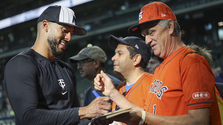 May 31, 2024; Houston, Texas, USA; Minnesota Twins shortstop Carlos Correa (4) signs autographs before the game against the Houston Astros at Minute Maid Park. Mandatory Credit: Troy Taormina-Imagn Images