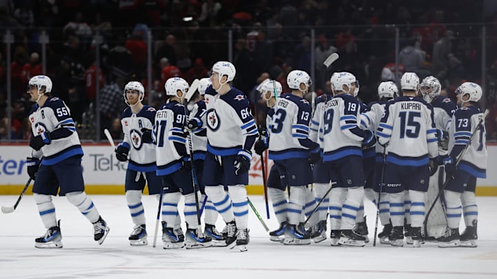 Feb 1, 2025; Washington, District of Columbia, USA; Winnipeg Jets players celebrate after their overtime game against the Washington Capitals at Capital One Arena. Mandatory Credit: Geoff Burke-Imagn Images