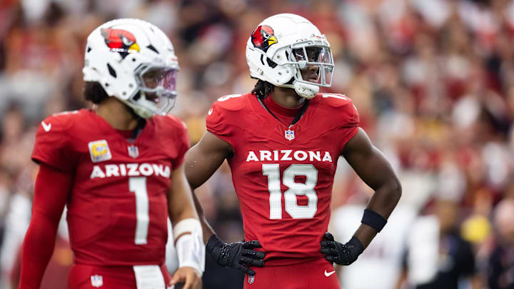 Sep 29, 2024; Glendale, Arizona, USA; Arizona Cardinals wide receiver Marvin Harrison Jr. (18) alongside quarterback Kyler Murray (1) against the Washington Commanders in the first half at State Farm Stadium. Mandatory Credit: Mark J. Rebilas-Imagn Images