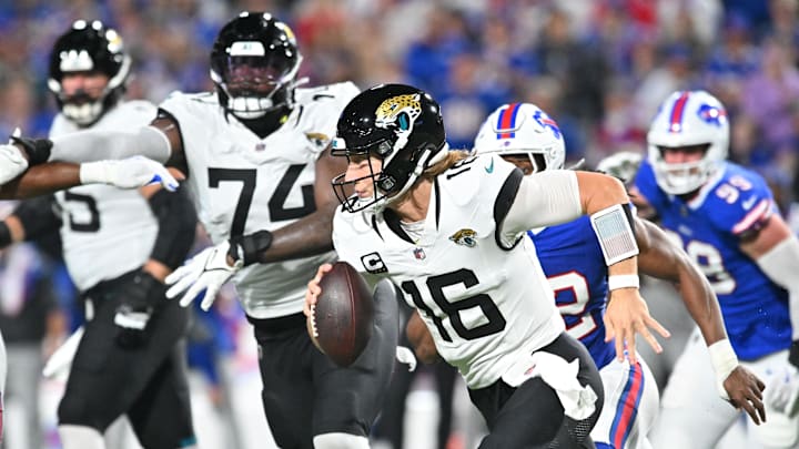 Sep 23, 2024; Orchard Park, New York, USA; Jacksonville Jaguars quarterback Trevor Lawrence (16) runs against the Buffalo Bills in the second quarter at Highmark Stadium. Mandatory Credit: Mark Konezny-Imagn Images