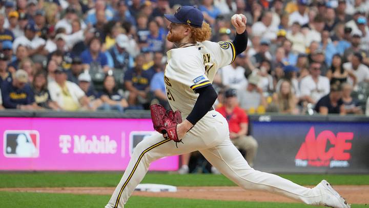 Oct 12, 2026; Milwaukee, Wisconsin, USA;  Milwaukee Brewers pitcher Dustin May (21) throws a pitch against the Los Angeles Dodgers during the fifth inning in game two of the NLCS for the 2026 MLB Playoffs at American Family Field.  Mandatory Credit: Michael McLoone-Imagn Images