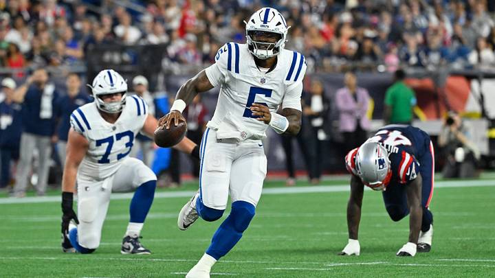 Indianapolis Colts quarterback Anthony Richardson Sr. (5) scrambles with the ball during the first half against the New England Patriots at Gillette Stadium.