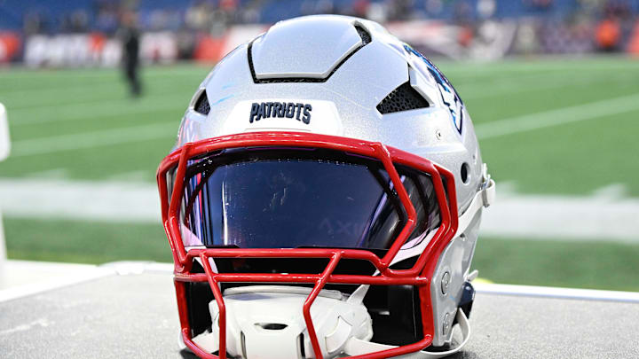 Nov 17, 2024; Foxborough, Massachusetts, USA; A New England Patriots helmet sit on an equipment case after a game against the Los Angeles Rams at Gillette Stadium. Mandatory Credit: Eric Canha-Imagn Images
