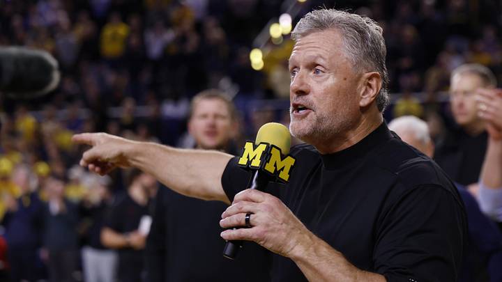 Jan 2, 2026; Ann Arbor, Michigan, USA;  Michigan Wolverines football head coach Kyle Whittingham speaks to the crowd during a time out in the first half against the Southern California Trojans at Crisler Center. Mandatory Credit: Rick Osentoski-Imagn Images