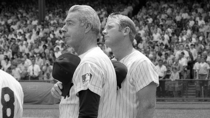 August 8, 1970; New York, NY, USA; Yankees Old Timers Joe DiMaggio and Mickey Mantle pause for the national anthem at the start of the annual Old-Timers' Day game at Yankee Stadium in New York City on August 8, 1970.