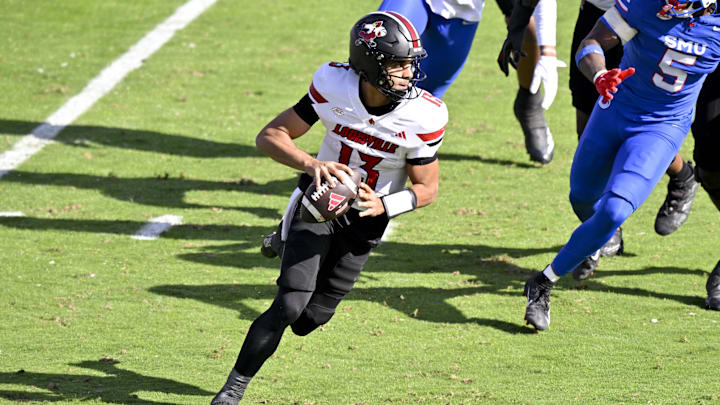 Nov 22, 2025; Dallas, Texas, USA;  Louisville Cardinals quarterback Deuce Adams (13) runs with the ball during the game between the Mustangs and the Cardinals at Gerald J. Ford Stadium. 