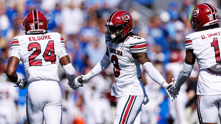 Sep 7, 2024; Lexington, Kentucky, USA; South Carolina Gamecocks defensive back O'Donnell Fortune (3) fives defensive back Jalon Kilgore (24) and defensive back DQ Smith (1) during the first quarter against the Kentucky Wildcats at Kroger Field. Mandatory Credit: Jordan Prather-Imagn Images Sep 7, 2024; Lexington, Kentucky, USA; South Carolina Gamecocks defensive back O'Donnell Fortune (3) fives defensive back Jalon Kilgore (24) and defensive back DQ Smith (1) during the first quarter against the Kentucky Wildcats at Kroger Field. Mandatory Credit: Jordan Prather-Imagn Images