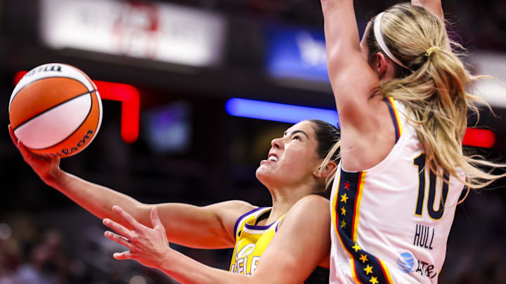 Jun 26, 2025; Indianapolis, Indiana, USA; Los Angeles Sparks guard Kelsey Plum (10) goes up for a basket against Indiana Fever guard Lexie Hull (10) in the first half at Gainbridge Fieldhouse. Mandatory Credit: Grace Smith/INDIANAPOLIS STAR-Imagn Images