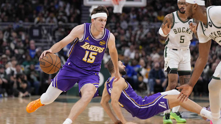 Nov 15, 2025; Milwaukee, Wisconsin, USA;  Los Angeles Lakers guard Austin Reaves (15) drives towards the basket during the fourth quarter against the Milwaukee Bucks at Fiserv Forum. Mandatory Credit: Jeff Hanisch-Imagn Images