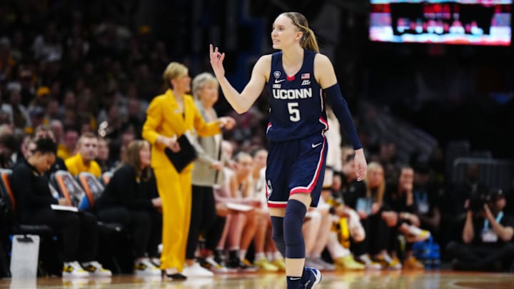 Apr 5, 2024; Cleveland, OH, USA; Connecticut Huskies guard Paige Bueckers (5) reacts in the second quarter against the Iowa Hawkeyes in the semifinals of the Final Four of the womens 2024 NCAA Tournament at Rocket Mortgage FieldHouse. Mandatory Credit: Kirby Lee-Imagn Images Apr 5, 2024; Cleveland, OH, USA; Connecticut Huskies guard Paige Bueckers (5) reacts in the second quarter against the Iowa Hawkeyes in the semifinals of the Final Four of the womens 2024 NCAA Tournament at Rocket Mortgage FieldHouse. Mandatory Credit: Kirby Lee-Imagn Images