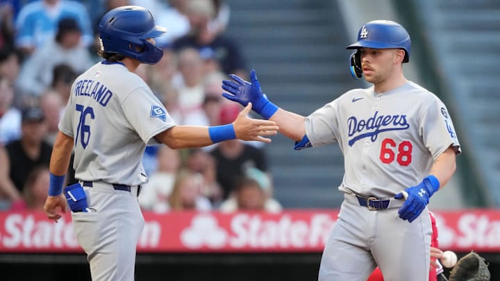 Aug 12, 2025; Anaheim, California, USA; Los Angeles Dodgers catcher Dalton Rushing (68) celebrates with second baseman Alex Freeland (76) after hitting a two-run home run in the second inning against the Los Angeles Angels at Angel Stadium. Mandatory Credit: Kirby Lee-Imagn Images