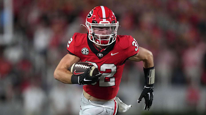 Sep 23, 2023; Athens, Georgia, USA; Georgia Bulldogs running back Cash Jones (32) carries the ball against the UAB Blazers in the first half at Sanford Stadium. Mandatory Credit: Kirby Lee-Imagn Images