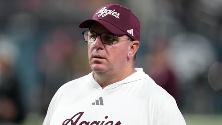 Dec 27, 2024; Las Vegas, NV, USA; Texas A&M Aggies head coach Mike Elko reacts against the Southern California Trojans in the first half at Allegiant Stadium. Mandatory Credit: Kirby Lee-Imagn Images