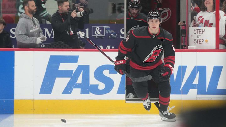 May 28, 2025; Raleigh, North Carolina, USA; Carolina Hurricanes defenseman Scott Morrow (56) enters the ice for warm up prior to the first period against the Florida Panthers in game five of the Eastern Conference Final of the 2025 Stanley Cup Playoffs at Lenovo Center. Mandatory Credit: James Guillory-Imagn Images