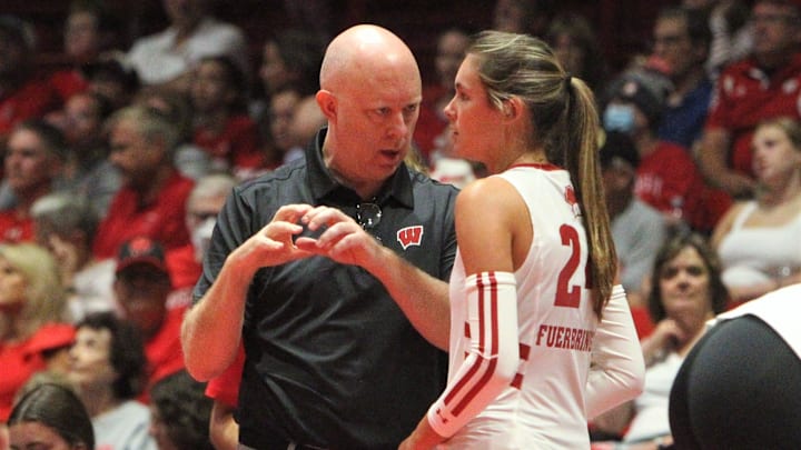 Wisconsin volleyball coach Kelly Sheffield and setter Charlie Fuerbringer talk during a timeout in the Badgers' exhibition match with Bradley on Tuesday Aug. 20, 2024 at the UW Field House in Madison, Wisconsin.