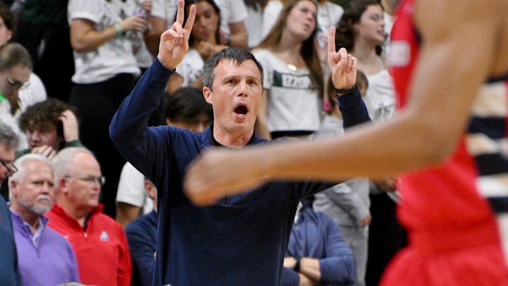 Samford Bulldogs head coach Bucky McMillan sends in a play during the first half against the Michigan State Spartans Samford Bulldogs head coach Bucky McMillan sends in a play during the first half against the Michigan State Spartans