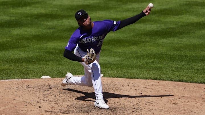 Aug 17, 2025; Denver, Colorado, USA; Colorado Rockies relief pitcher Luis Peralta (41) delivers a pitch in the sixth inning against the Arizona Diamondbacks at Coors Field. Mandatory Credit: Ron Chenoy-Imagn Images