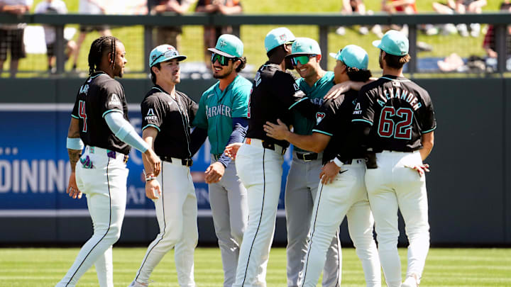 The Arizona Diamondbacks greet their former teammates Seattle Mariners Josh Rojas and Dominic Canzone during a spring training game at Salt River Fields on March 22, 2024. The Arizona Diamondbacks greet their former teammates Seattle Mariners Josh Rojas and Dominic Canzone during a spring training game at Salt River Fields on March 22, 2024.