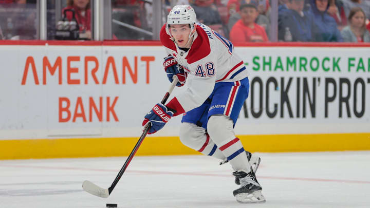 Mar 30, 2025; Sunrise, Florida, USA; Montreal Canadiens defenseman Lane Hutson (48) moves the puck against the Florida Panthers during the first period at Amerant Bank Arena. Mandatory Credit: Sam Navarro-Imagn Images
