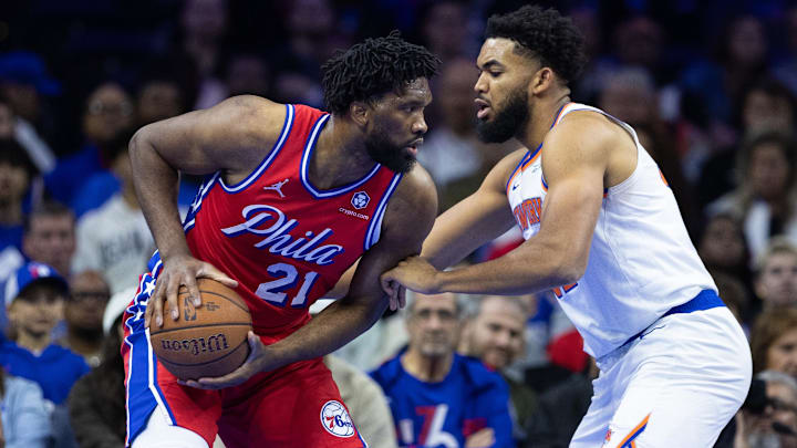 Nov 12, 2024; Philadelphia, Pennsylvania, USA; Philadelphia 76ers center Joel Embiid (21) controls the ball against New York Knicks center Karl-Anthony Towns (32) during the first quarter at Wells Fargo Center. Mandatory Credit: Bill Streicher-Imagn Images