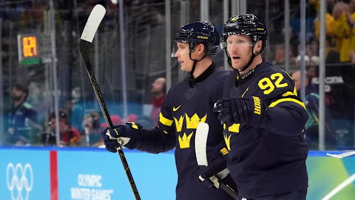 Feb 17, 2026; Milan, Italy;  Gabriel Landeskog of Sweden celebrates scoring their second goal  against Latvia during a men's ice hockey qualification playoff game during the Milano Cortina 2026 Olympic Winter Games at Milano Santagiulia Ice Hockey Arena. Mandatory Credit: Amber Searls-Imagn Images
