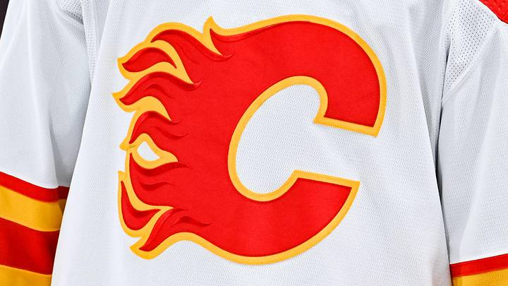 Dec 12, 2022; Montreal, Quebec, CAN; View of a Calgary Flames logo on a jersey worn by the member of the team during the second period at Bell Centre. Mandatory Credit: David Kirouac-Imagn Images