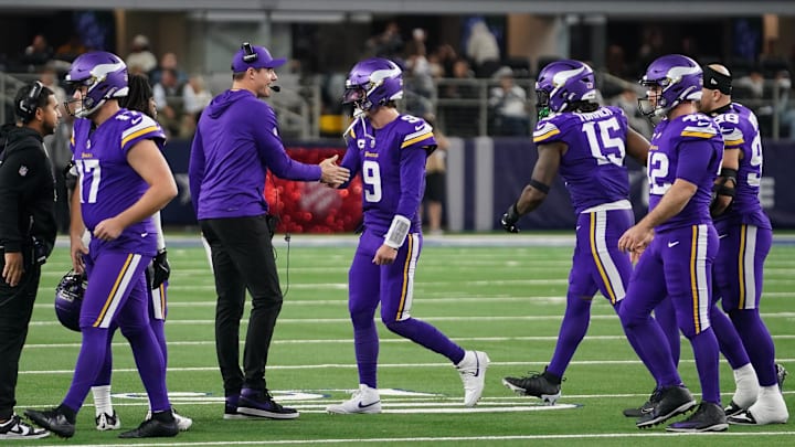 Dec 14, 2025; Arlington, Texas, USA; Minnesota Vikings quarterback J.J. McCarthy (9) slaps hands with Minnesota Vikings head coach Kevin O'Connell after a made field goal against the Dallas Cowboys during the second half at AT&T Stadium. Mandatory Credit: Raymond Carlin III-Imagn Images