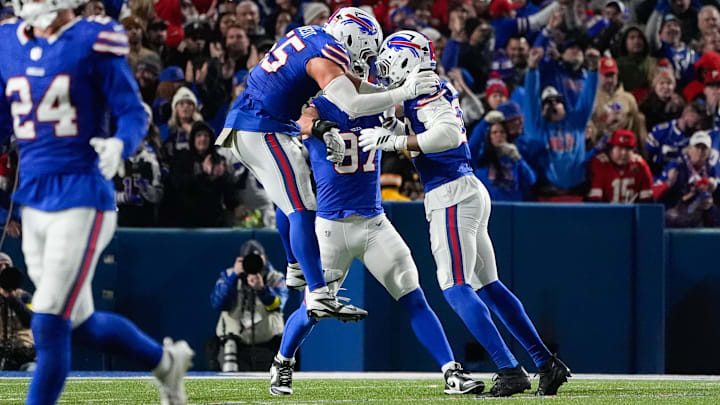 Buffalo Bills defensive end Michael Hoecht celebrates a defensive stop with defensive end Greg Rousseau.
