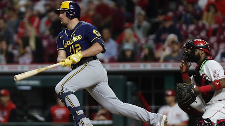 Sep 24, 2022; Cincinnati, Ohio, USA; Milwaukee Brewers right fielder Hunter Renfroe (12) hits an RBI