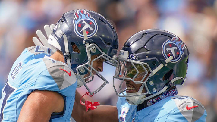Tennessee Titans wide receiver Chimere Dike (17) celebrates his touchdown with running back Tony Pollard (20) during the first quarter against the New England Patriots at Nissan Stadium in Nashville, Tenn., Sunday, Oct. 19, 2025. Tennessee Titans wide receiver Chimere Dike (17) celebrates his touchdown with running back Tony Pollard (20) during the first quarter against the New England Patriots at Nissan Stadium in Nashville, Tenn., Sunday, Oct. 19, 2025.
