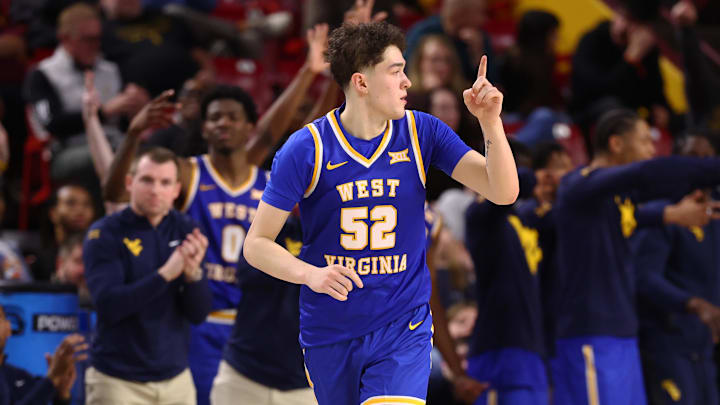 Jan 21, 2026; Tempe, Arizona, USA; West Virginia Mountaineers forward Treysen Eaglestaff (52) celebrates a shot against the Arizona State Sun Devils in the second half at Desert Financial Arena. 