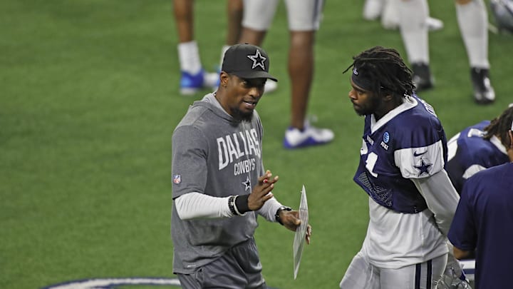 Dallas Cowboys player Trevon Diggs talks with Al Harris during training camp at Ford Center at The Star.