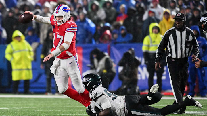 Dec 28, 2025; Orchard Park, New York, USA; Philadelphia Eagles linebacker Jaelan Phillips (50) tackles Buffalo Bills quarterback Josh Allen (17) during the first quarter at Highmark Stadium