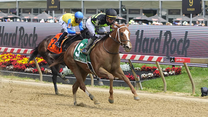 May 17, 2025; Baltimore, Maryland, USA; Zeitlos (5) with Jose L. Ortiz up wins Race 6 - the Skipat Stakes over Striker Has Dial (7) with Kendrick Carmouche up at Pimlico Race Course in Baltimore, MD.  