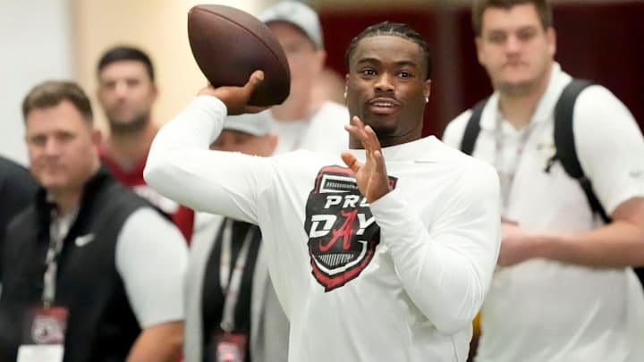 Mar 19, 2025; Tuscaloosa AL, USA; Quarterback Jalen Milroe throws for scouts at the University of Alabama Pro Day as several Crimson Tide players worked out for NFL teams in the Hank Crisp Indoor Practice Facility.