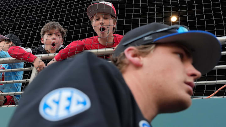Some young Georgia fans bark at Kentucky players as they enter the dugout during a NCAA baseball game against Kentucky on March 14, 2025.