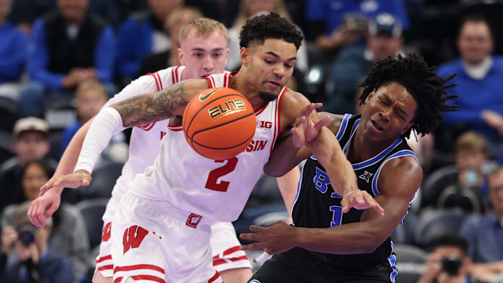 Nov 21, 2025; Salt Lake City, Utah, USA; Wisconsin Badgers guard Nick Boyd (2) steals the ball from BYU Cougars guard Robert Wright III (1) during the first half at Delta Center. Mandatory Credit: Rob Gray-Imagn Images Nov 21, 2025; Salt Lake City, Utah, USA; Wisconsin Badgers guard Nick Boyd (2) steals the ball from BYU Cougars guard Robert Wright III (1) during the first half at Delta Center. Mandatory Credit: Rob Gray-Imagn Images