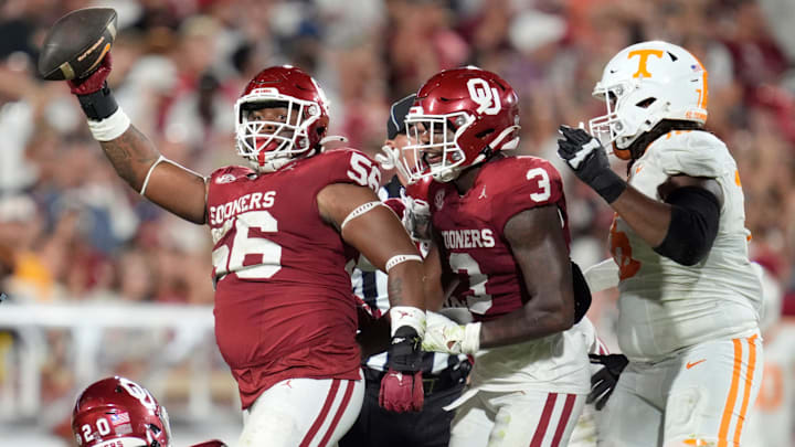 Oklahoma Sooners defensive lineman Gracen Halton (56) celebrates beside defensive back Robert Spears-Jennings (3) and Tennessee Volunteers offensive lineman Javontez Spraggins (76) after recovering a fumble during a college football game between the University of Oklahoma Sooners (OU) and the Tennessee Volunteers at Gaylord Family - Oklahoma Memorial Stadium in Norman, Okla., Saturday, Sept. 21, 2024.