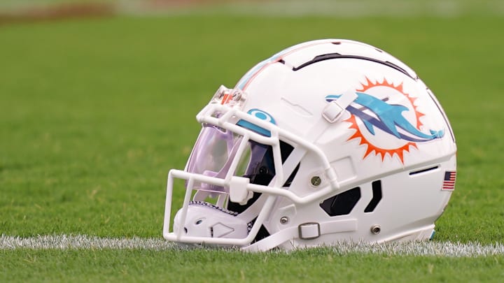 Jul 27, 2022; Miami Gardens, FL, USA; A general view of a Miami Dolphins helmet on the field during training camp at Baptist Health Training Complex. Mandatory Credit: Jasen Vinlove-Imagn Images Jul 27, 2022; Miami Gardens, FL, USA; A general view of a Miami Dolphins helmet on the field during training camp at Baptist Health Training Complex. Mandatory Credit: Jasen Vinlove-Imagn Images