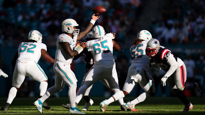Nov 24, 2024; Miami Gardens, Florida, USA; Miami Dolphins quarterback Tua Tagovailoa (1) attempts a pass against the New England Patriots during the second half at Hard Rock Stadium. Mandatory Credit: Jasen Vinlove-Imagn Images