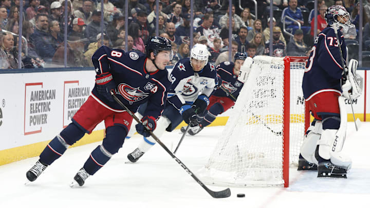 Apr 4, 2026; Columbus, Ohio, USA; Columbus Blue Jackets defenseman Zach Werenski (8) skates with the puck as Winnipeg Jets center Gabriel Vilardi (13) trails the play during the first period at Nationwide Arena. Mandatory Credit: Russell LaBounty-Imagn Images