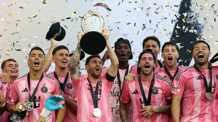 Inter Miami CF captain Lionel Messi lifts the 2025 MLS Cup trophy as he and his teammates celebrate their first league championship.