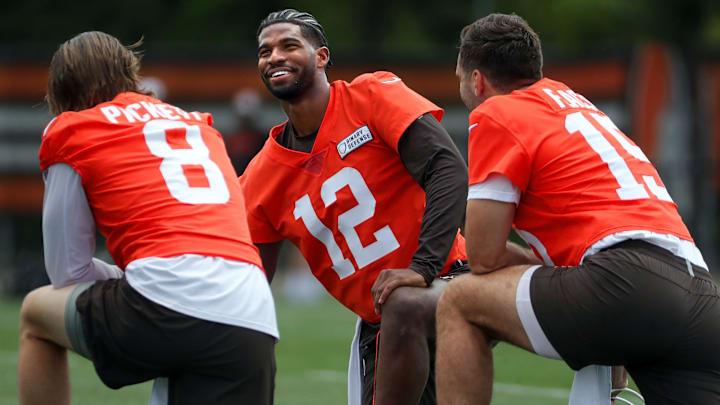 Browns quarterbacks Shedeur Sanders (12), Kenny Pickett (8) and Joe Flacco (15) talk during minicamp, Tuesday, June 10, 2025, in Berea. Browns quarterbacks Shedeur Sanders (12), Kenny Pickett (8) and Joe Flacco (15) talk during minicamp, Tuesday, June 10, 2025, in Berea.